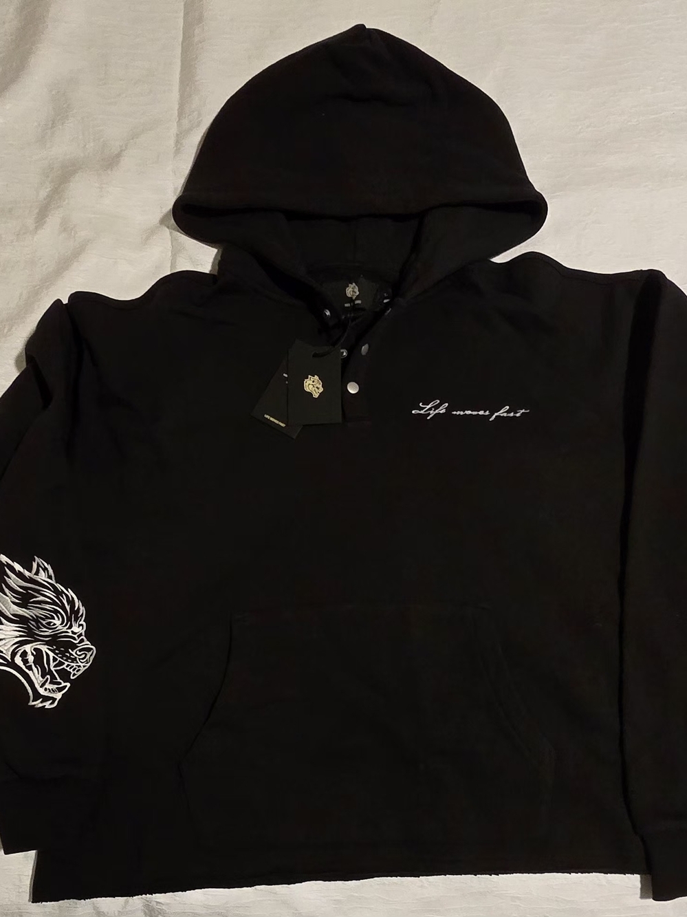 Black Hooded Pullover with White Script and Sleeve Artwork